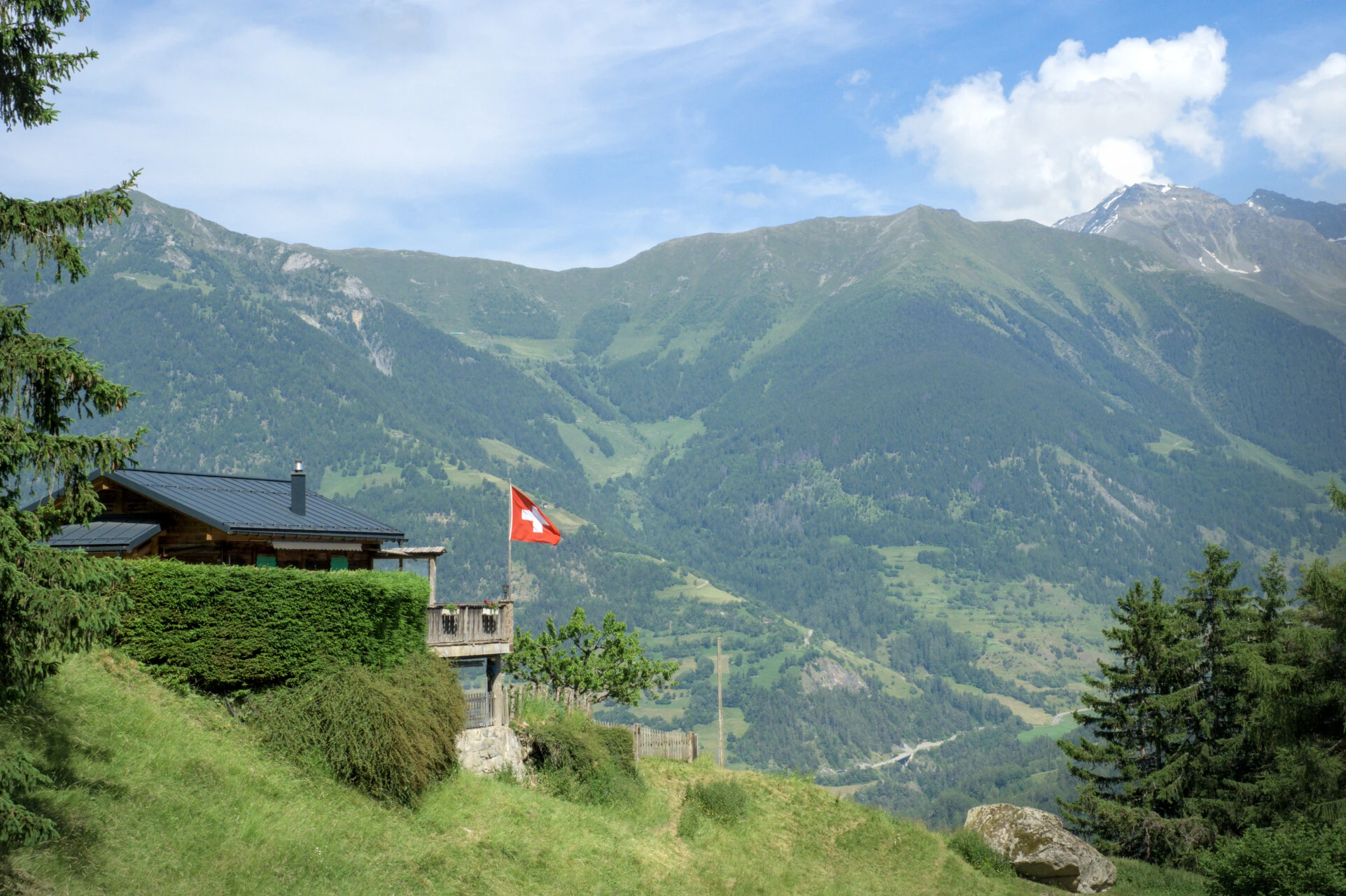 swiss-chalet-flag-green-hillside-champex-village-tmb.jpg - 69a1ed62c4a04